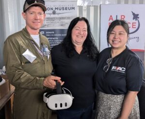 Three people holding virtual reality headset provided by RATCH-Australia MEWF Community Fund in round 1 2024.